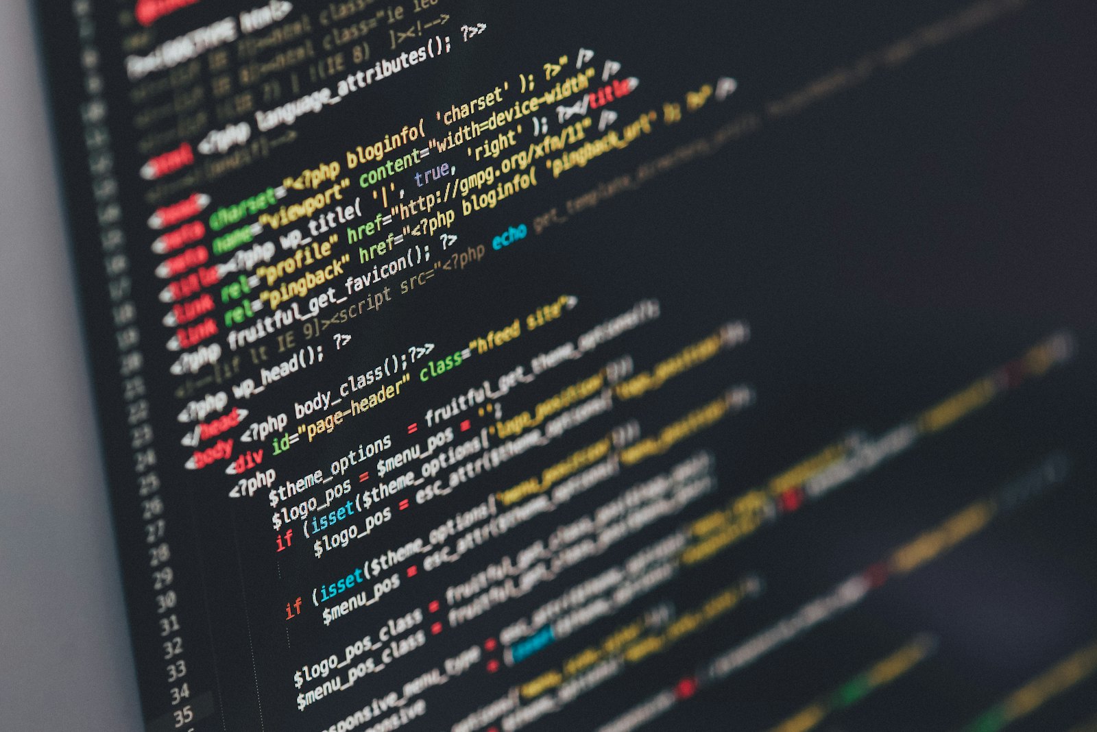 A NextStep developer building custom AI at a workstation, code and the NextStep brand on screen